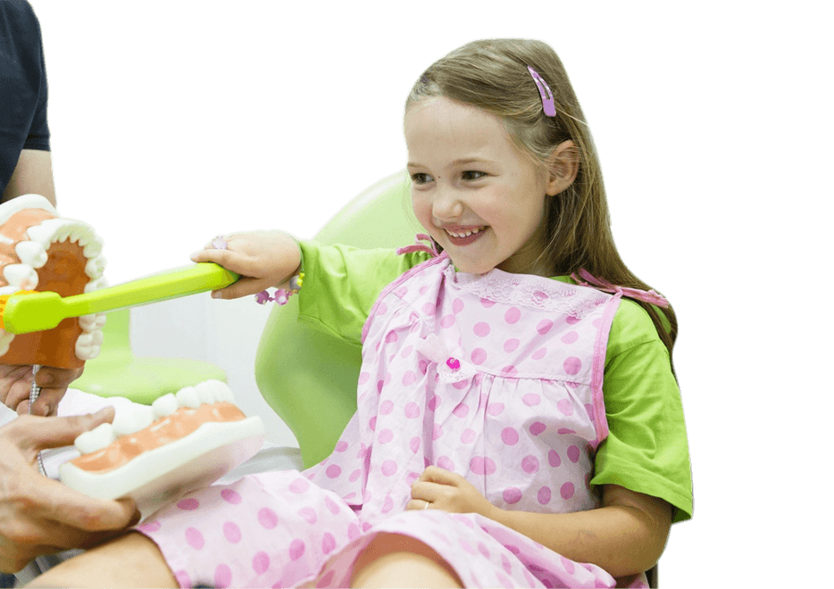 Smiling little girl in dentists chair